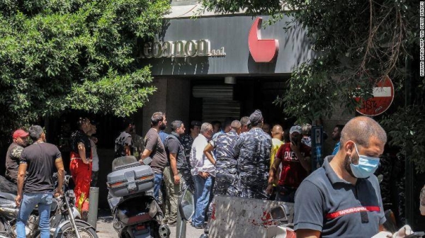 Armed man takes hostages at Beirut bank demanding return of frozen funds