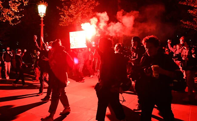 French Police Use Tear Gas To Stop Protests Over Iranian Woman's Death
