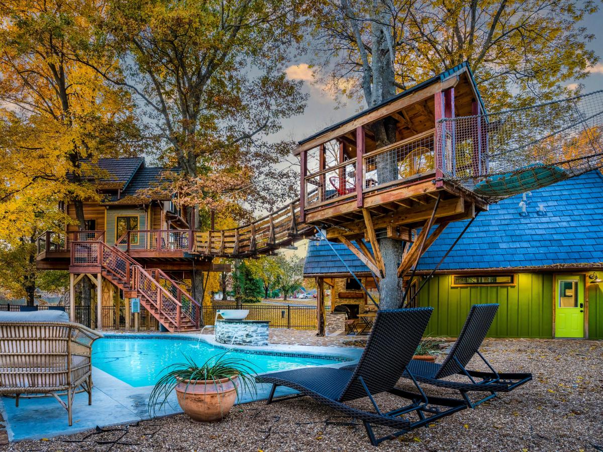 An Arkansas man spent 2 years building a treehouse as a retirement project. He's listing it for $1.25 million, and it comes with a heated pool and a swinging bridge — check it out.